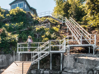 Steel stair system with shoreside platform as a landing.